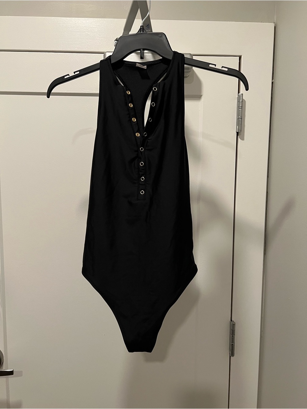 Black Womens One-Piece Button-Front Swimsuit featuring Gold Snap Button Closure